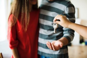 handing over keys to tenants