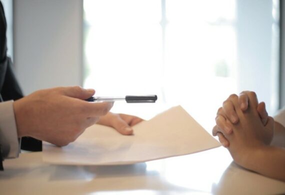 A person giving a contract to another person to sign