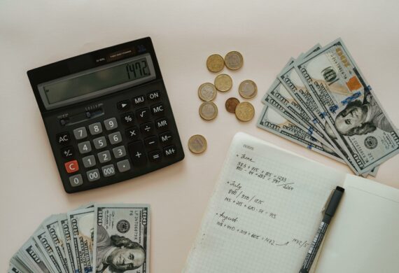 calculator money coins and cash for budgeting.