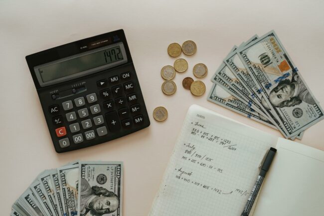 calculator money coins and cash for budgeting.