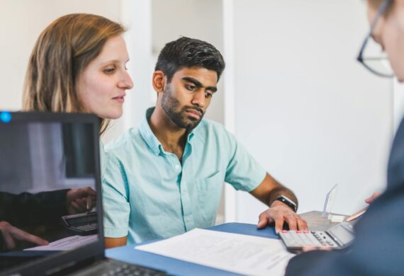 three people in a meeting