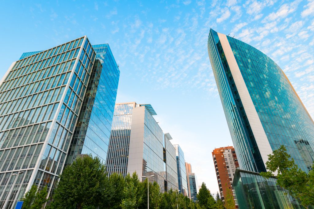 Glass commercial office towers viewed from below