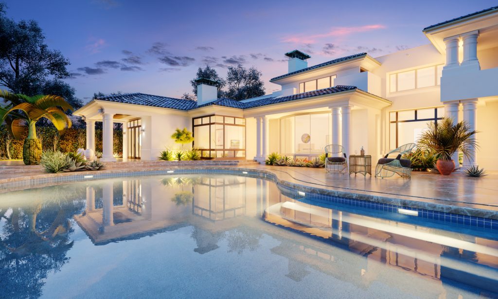 Luxury home with a swimming pool lit at dusk