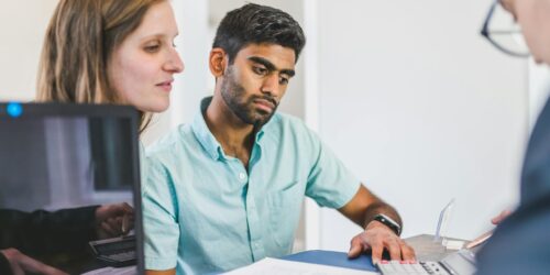 three people in a meeting